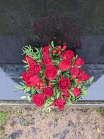 Filled Grave  pot  red roses and berries